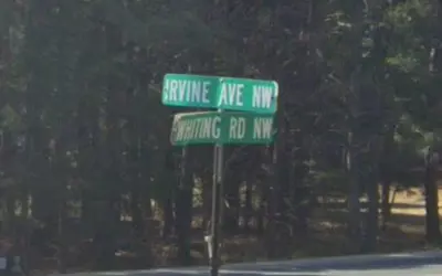 Damaged road name sign